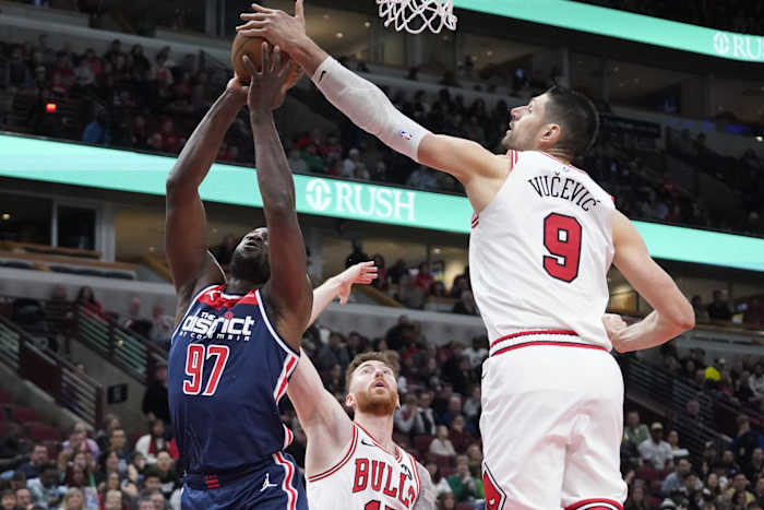 Chicago Bulls center Nikola Vucevic (9) defends Washington Wizards forward Eugene Omoruyi (97) during the second half at United Center.